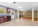 Spacious kitchen featuring tile backsplash, stainless sink, and an open view to living area at 273 Baywood Xing, Hiram, GA 30141