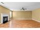 Bright and open living room with a fireplace, hardwood floors, and a ceiling fan at 273 Baywood Xing, Hiram, GA 30141