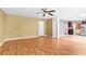 Open-concept living room featuring hardwood floors and neutral-toned walls leading into the kitchen at 273 Baywood Xing, Hiram, GA 30141