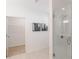 Modern bathroom features a glass-enclosed shower, tile flooring, and a neutral color scheme at 371 Grant Cir # 1813, Atlanta, GA 30315