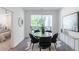 Elegant dining area with a sliding glass door and a contemporary table set at 371 Grant Cir # 1813, Atlanta, GA 30315