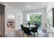 Bright dining area with sliding glass doors, an elegant table set, and access to the balcony at 371 Grant Cir # 1813, Atlanta, GA 30315