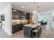 An elegant kitchen with stainless steel appliances, granite countertops, and bar stool seating at the island at 371 Grant Cir # 1813, Atlanta, GA 30315