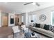 Open-concept living room with a ceiling fan, stylish furniture, and two windows at 371 Grant Cir # 1813, Atlanta, GA 30315