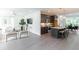 Bright and airy living room with hardwood floors flowing into the kitchen with a granite island and modern appliances at 371 Grant Cir # 1813, Atlanta, GA 30315