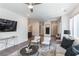 The open living room offers views of the kitchen, ceiling fan, furniture, and decor at 371 Grant Cir # 1813, Atlanta, GA 30315