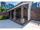 The covered outdoor kitchen boasts stone pillars, countertop space and is perfect for entertaining at 371 Grant Cir # 1813, Atlanta, GA 30315