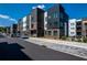 Modern townhome exteriors showcase brick and siding, with ample street parking on a sunny day at 371 Grant Cir # 1813, Atlanta, GA 30315