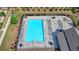 Aerial view of the community pool showcasing its size, seating, and well-maintained surroundings at 767 Farmstead Rd, Suwanee, GA 30024
