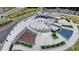 Aerial view of community park showcasing modern water feature, seating area, and landscaped walkways at 767 Farmstead Rd, Suwanee, GA 30024