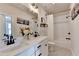 Bathroom features a double sink vanity with white countertop and contemporary fixtures at 767 Farmstead Rd, Suwanee, GA 30024