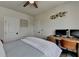 Inviting bedroom featuring a wooden desk, twin monitors, and light color interior design at 767 Farmstead Rd, Suwanee, GA 30024