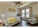 Comfortable bedroom featuring a bed, a chair, a window, and an interior design that inspires comfort at 767 Farmstead Rd, Suwanee, GA 30024