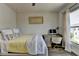 Bright bedroom features a workspace desk and a large window with natural light at 767 Farmstead Rd, Suwanee, GA 30024