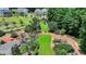 Scenic community park with walking paths, mature trees, and a charming red pavilion at 767 Farmstead Rd, Suwanee, GA 30024