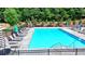 Sparkling community pool with ample seating and lounge chairs for relaxation and enjoyment at 767 Farmstead Rd, Suwanee, GA 30024