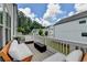 Relaxing outdoor deck with comfortable seating and modern fire pit, perfect for entertaining friends and Gathering at 767 Farmstead Rd, Suwanee, GA 30024
