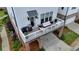 Elevated deck area perfect for outdoor relaxation, complete with seating, grill, and easy access to the garage and driveway at 767 Farmstead Rd, Suwanee, GA 30024