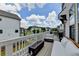 Outdoor deck area with a modern fire pit, comfortable seating, and an outdoor grill for entertaining guests at 767 Farmstead Rd, Suwanee, GA 30024