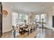 Elegant dining room with large windows and stylish table setting at 767 Farmstead Rd, Suwanee, GA 30024