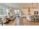 Open-concept dining room flowing into a modern kitchen at 767 Farmstead Rd, Suwanee, GA 30024