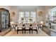 Formal dining room with neutral colors and large window at 767 Farmstead Rd, Suwanee, GA 30024