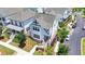 Beautiful two-story home featuring manicured landscaping, a welcoming porch, and a charming exterior design at 767 Farmstead Rd, Suwanee, GA 30024
