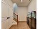 Open hallway features hardwood floors, storage closet, staircase, and a large fish tank at 767 Farmstead Rd, Suwanee, GA 30024