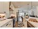 Modern kitchen features white cabinets, stainless steel appliances, and an island with pendant lighting at 767 Farmstead Rd, Suwanee, GA 30024