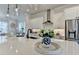 Modern kitchen with stainless steel appliances, a large island, and pendant lighting at 767 Farmstead Rd, Suwanee, GA 30024