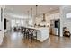 Open-concept kitchen flows into a dining area with seating for six and stainless steel appliances at 767 Farmstead Rd, Suwanee, GA 30024