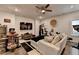 Spacious living room includes hardwood floors, a ceiling fan, and a home entertainment center at 767 Farmstead Rd, Suwanee, GA 30024