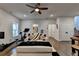 This well-equipped living room features a ceiling fan, gym, television, and exercise equipment at 767 Farmstead Rd, Suwanee, GA 30024