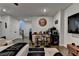 Bright and airy, the living room offers a bar, television, hallway, and hardwood flooring at 767 Farmstead Rd, Suwanee, GA 30024