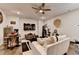 Cozy living room offers a bar area, a home gym, a television, and hardwood flooring at 767 Farmstead Rd, Suwanee, GA 30024