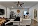 Modern living room features a mounted television, bathroom, and home gym with exercise equipment at 767 Farmstead Rd, Suwanee, GA 30024