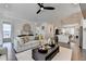 The stylish living room connects to the kitchen and dining area in this open-concept floor plan at 767 Farmstead Rd, Suwanee, GA 30024