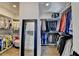Spacious walk-in closet with custom shelving, ample hanging space, and full length mirror at 767 Farmstead Rd, Suwanee, GA 30024
