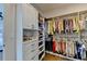 Custom walk-in closet offers extensive storage solutions, shelving and hanging space at 767 Farmstead Rd, Suwanee, GA 30024