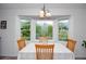 Charming breakfast nook featuring large bay window offering scenic backyard views at 830 Montego Sw Way, Lilburn, GA 30047