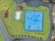 Aerial view of community pool, playground and basketball court. Featuring a parking area and landscaping at 1876 Hamby Place Nw Dr, Acworth, GA 30102
