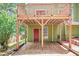 Two-story back porch with a red door below, offering outdoor living space at 1876 Hamby Place Nw Dr, Acworth, GA 30102