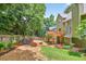 Spacious backyard with a wooden fence and elevated wooden deck at 1876 Hamby Place Nw Dr, Acworth, GA 30102