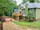 Spacious backyard features a wooden deck, partially fenced yard and lush trees at 1876 Hamby Place Nw Dr, Acworth, GA 30102