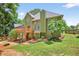 Backyard showcasing the two-story deck and patio space, set against green lawn at 1876 Hamby Place Nw Dr, Acworth, GA 30102
