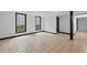 Finished basement offers neutral tile flooring and black framed windows bringing in plenty of natural light at 1876 Hamby Place Nw Dr, Acworth, GA 30102