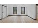 Finished basement offers neutral tile flooring and black framed windows bringing in plenty of natural light at 1876 Hamby Place Nw Dr, Acworth, GA 30102