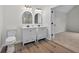 Bathroom with dual vanities and new light fixtures at 1876 Hamby Place Nw Dr, Acworth, GA 30102