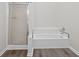 Bathroom featuring a shower and tile backsplash at 1876 Hamby Place Nw Dr, Acworth, GA 30102