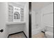 Neutral-toned full bathroom features a combination shower and vanity, with built in shelving at 1876 Hamby Place Nw Dr, Acworth, GA 30102